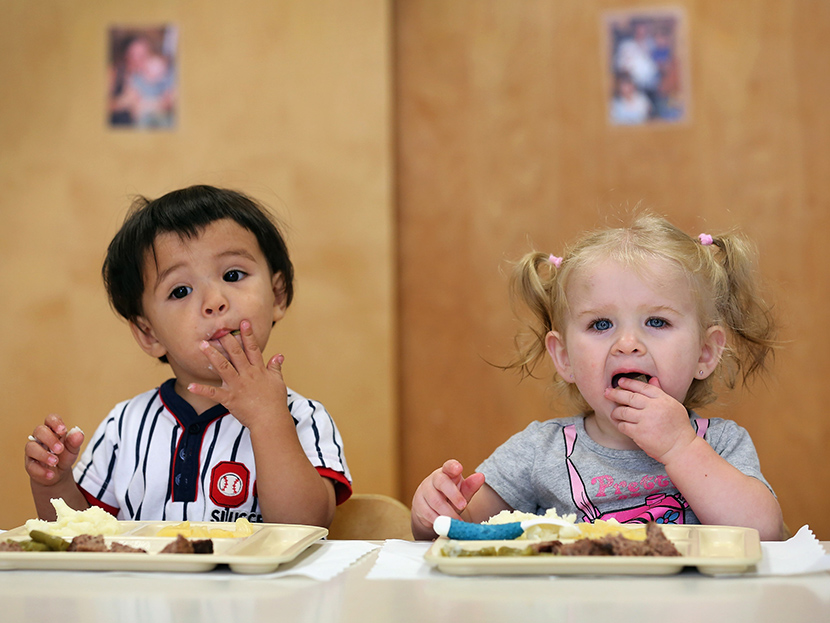 Children eat lunch at the federally-funded Head Start school on September 20, 2012 in Woodbourne, New York. (Photo by John Moore/Getty)