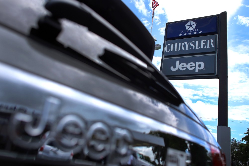 A Chrysler Jeep sign is seen outside a Chrysler Jeep car dealership in Hollywood, Fla. (Photo by Joe Raedle/Getty)