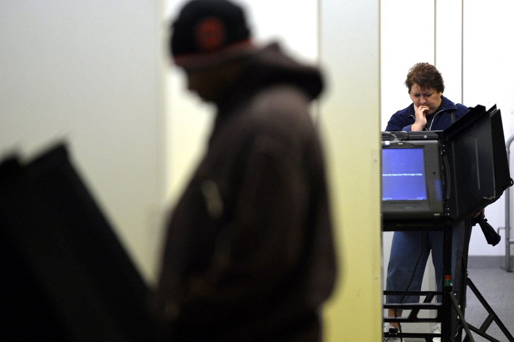 People cast their ballots for the presidential election at an early voting center in Columbus, Ohio, on Oct. 15, 2012.