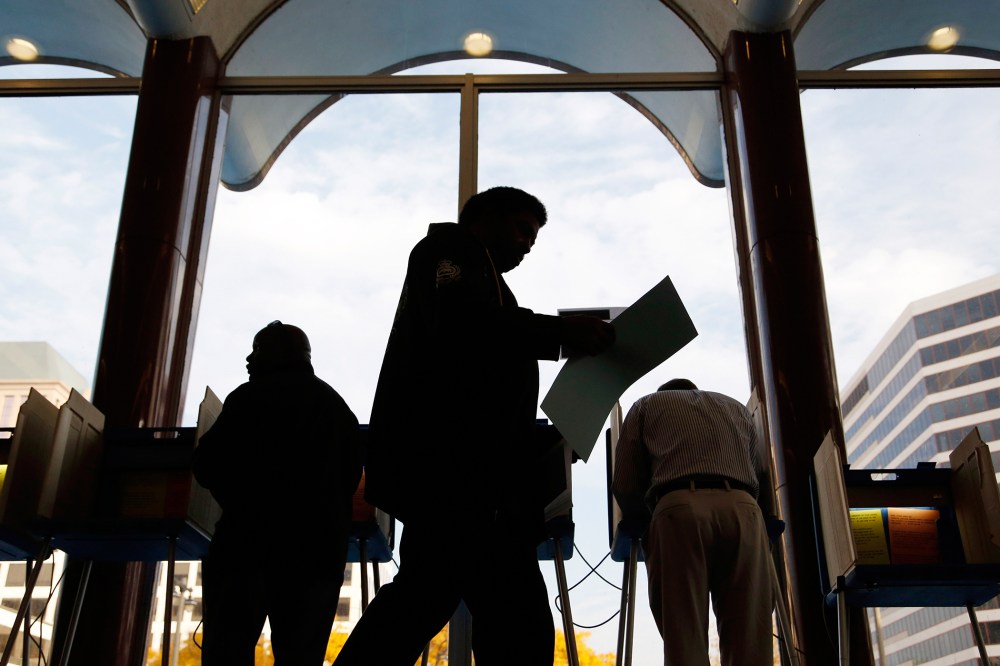 Milwaukee residents cast their ballots during early voting at the Milwaukee Municipal Building Oct., 22, 2012 Milwaukee, Wis. (Photo by Darren Hauck/Getty)