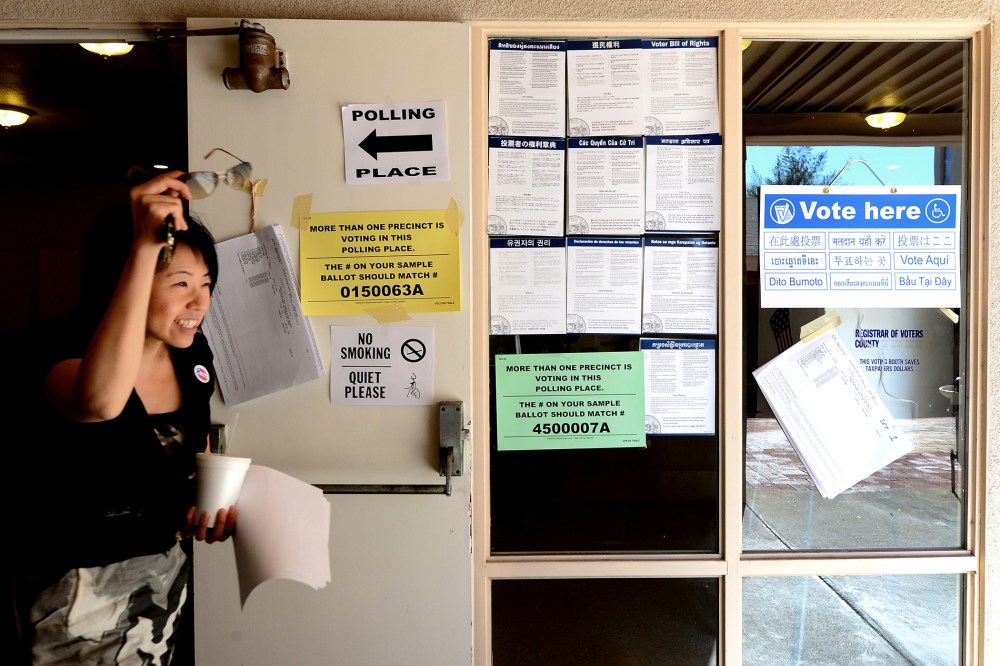 Ji Son celebrates after voting on election day at Christ Lutheran Church in Monterey Park, Los Angeles County, on Nov. 6, 2012 in California.