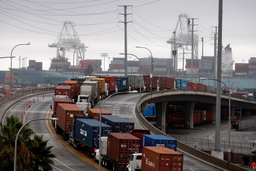 Shipping container trucks sit in traffic at the seaport, Nov.  29, 2012 in Long Beach, Calif.