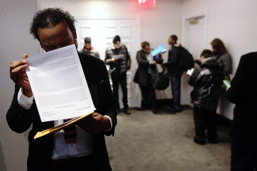 Applicants wait in line to meet potential employers at the Diversity Job Fair on Dec. 6, 2012 in New York, NY.