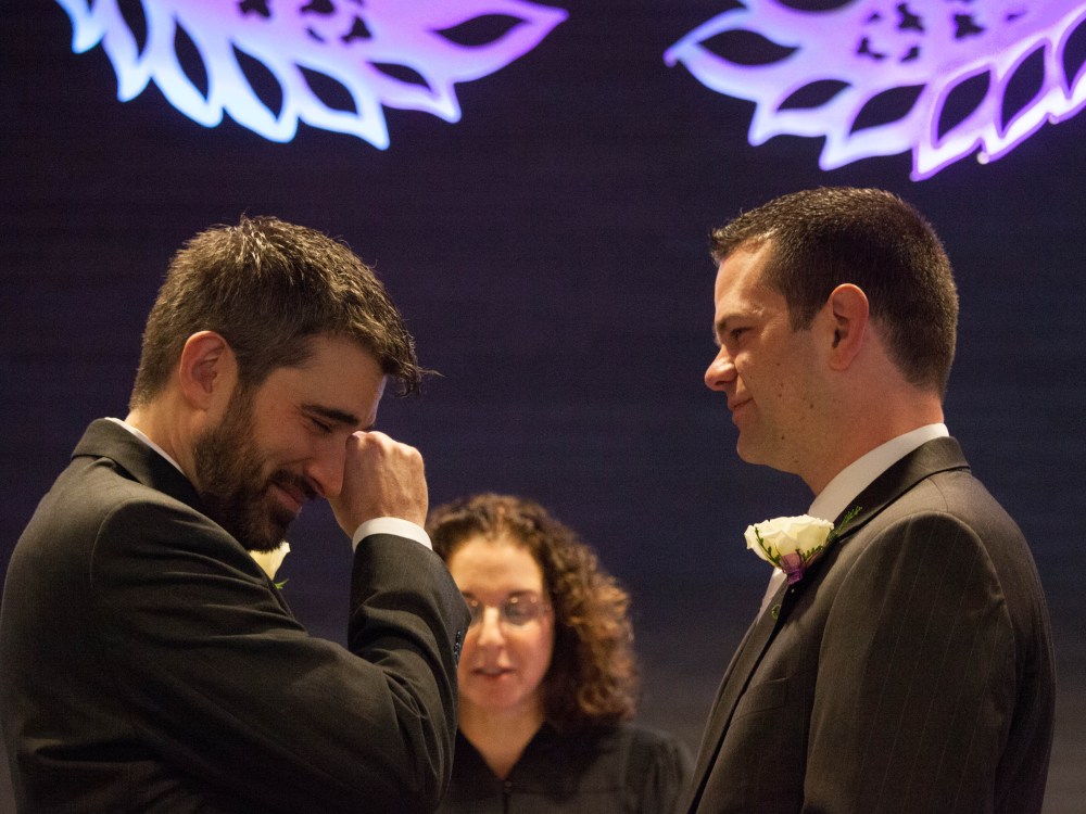 Steven Austin and Michael Pirkle during their wedding at City Hall on December 9, 2012 in Seattle, Washington--the first day that same-sex couples could legally wed in the state. The two have been together for 12 years. (Photo by David Ryder/Getty Images)