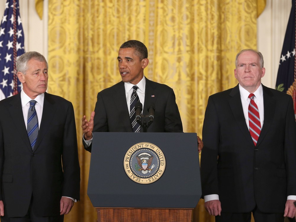U.S. President Barack Obama (C) speaks during a news conference with chief counterterrorism adviser John Brennan (L), and former U.S. Sen. Chuck Hagel (R-NB) in the East Room at the White House on January 7, 2013 in Washington, DC. Pending approval by...