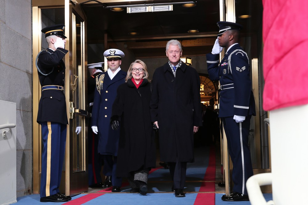Secretary of State Hillary Clinton and former President Bill Clinton arrive during the presidential inauguration on the West Front of the U.S. Capitol, Jan. 21, 2013, in Washington, D.C.