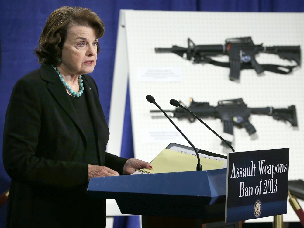 U.S. Senator Dianne Feinstein (D-CA) speaks next to a display of assault weapons during a news conference January 24, 2013 on Capitol Hill in Washington, DC. Feinstein announced that she will introduce a bill to ban assault weapons and high-capacity...