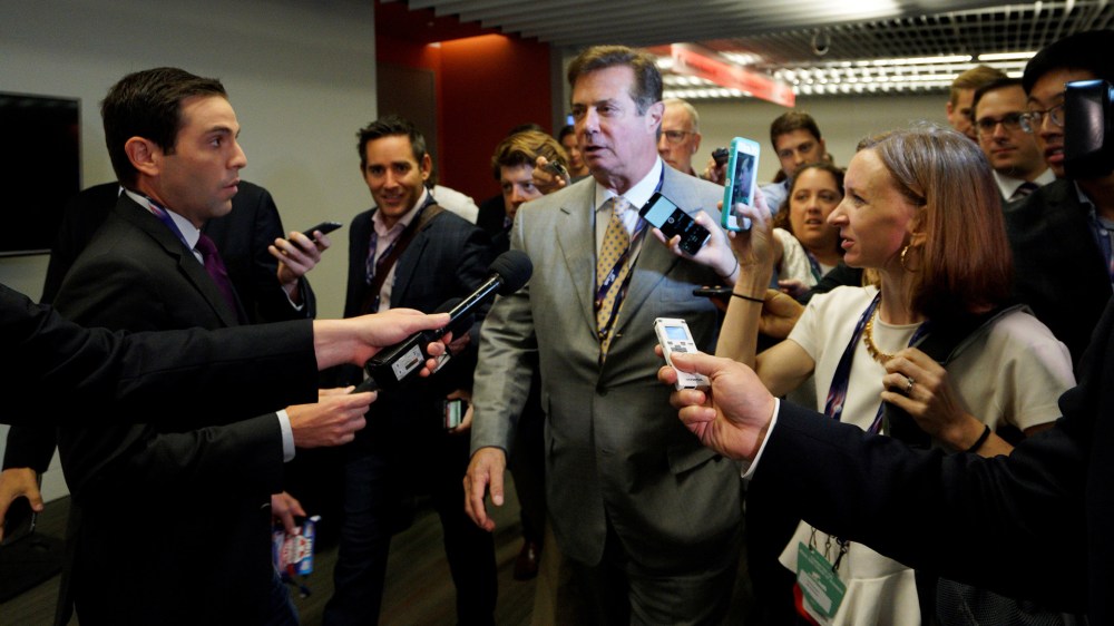 Paul Manafort, campaign manager to Republican Presidential Candidate Donald Trump, is surrounded by reporters in Cleveland, Ohio, July 14, 2016. (Photo by Rick Wilking/Reuters)