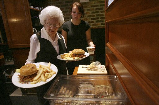 Rose Donaghey, 88, foreground, and Priscilla Adams work during the lunch hour at the Wicked Wolf restaurant in the East Tremont section of the Bronx,  Wednesday, Oct. 15, 2008 in New York.  (AP Photo/Mary Altaffer)