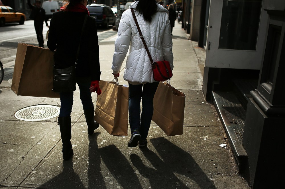 Women walk down Broadway with shopping bags on Feb. 7, 2013 in New York, N.Y. (Photo by Spencer Platt/Getty)