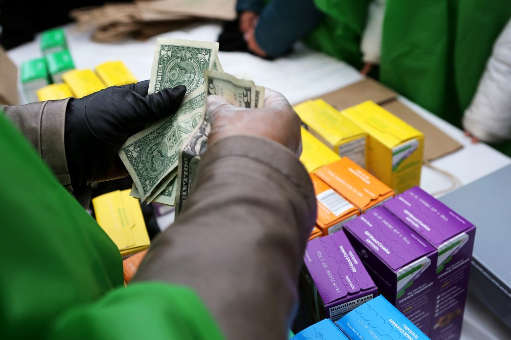 Girl Scouts sell cookies in New York, Feb. 8, 2013.