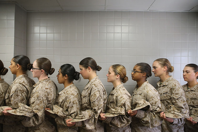 Female Marine recruits stand in line before getting lunch in the chow hall during boot camp on February 26, 2013 at MCRD Parris Island, South Carolina.  (Photo by Scott Olson/Getty Images)