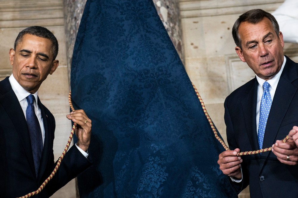 President Barack Obama (L) and Speaker of the House John Boehner (R-OH) wait to unveil a statue of Rosa Parks during an unveiling in Statuary Hall on Capitol Hill, Feb. 27, 2013 in Washington, D.C.