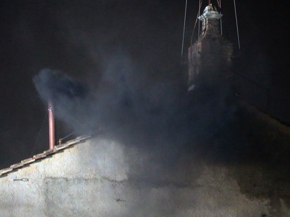 Black smoke billows out from a chimney on the roof of the Sistine Chapel indicating that the College of Cardinals have failed to elect a new Pope on March 12, 2013 in Vatican City, Vatican. Pope Benedict XVI's successor is being chosen by the College...