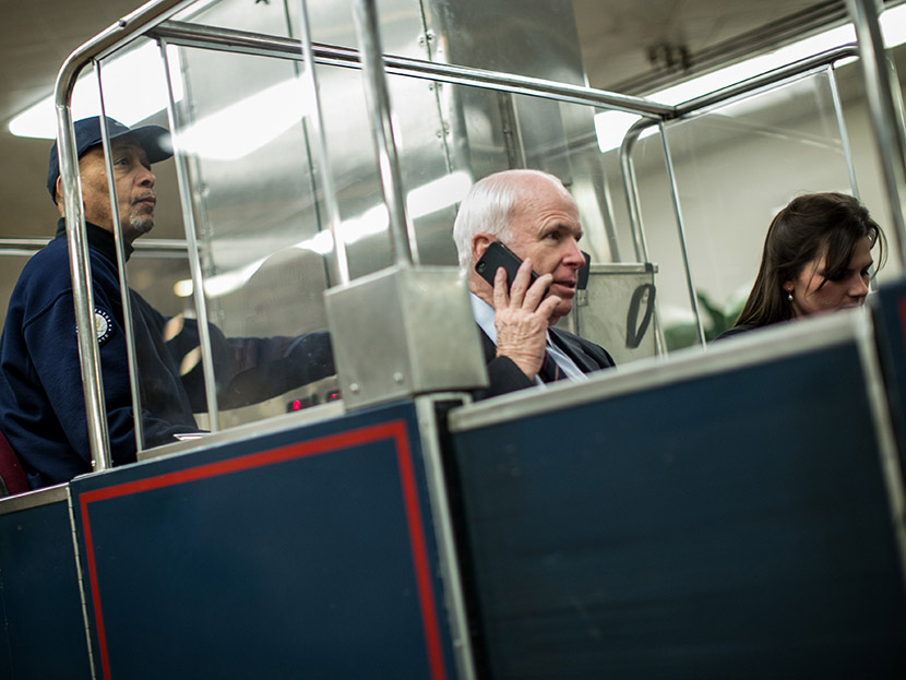 U.S. Sen. John McCain (R-AZ) (C) rides the Senate subway prior to votes on Capitol Hill March 22, 2013 in Washington, DC. (Photo by Drew Angerer/Getty Images)