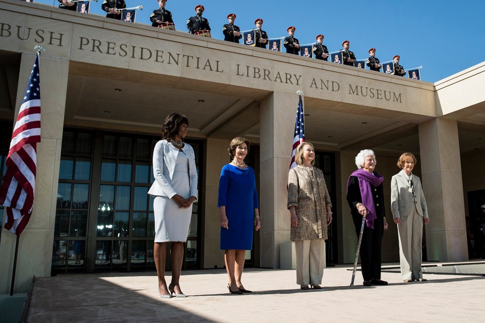 From left US first lady Michelle Obama, stands with former first ladies Laura Bush, Hillary Clinton, Barbara Bush and Rosalynn Carter as they arrive for a dedication ceremony at the George W. Bush Library and Museum, April 25, 2013 in Dallas, Texas.