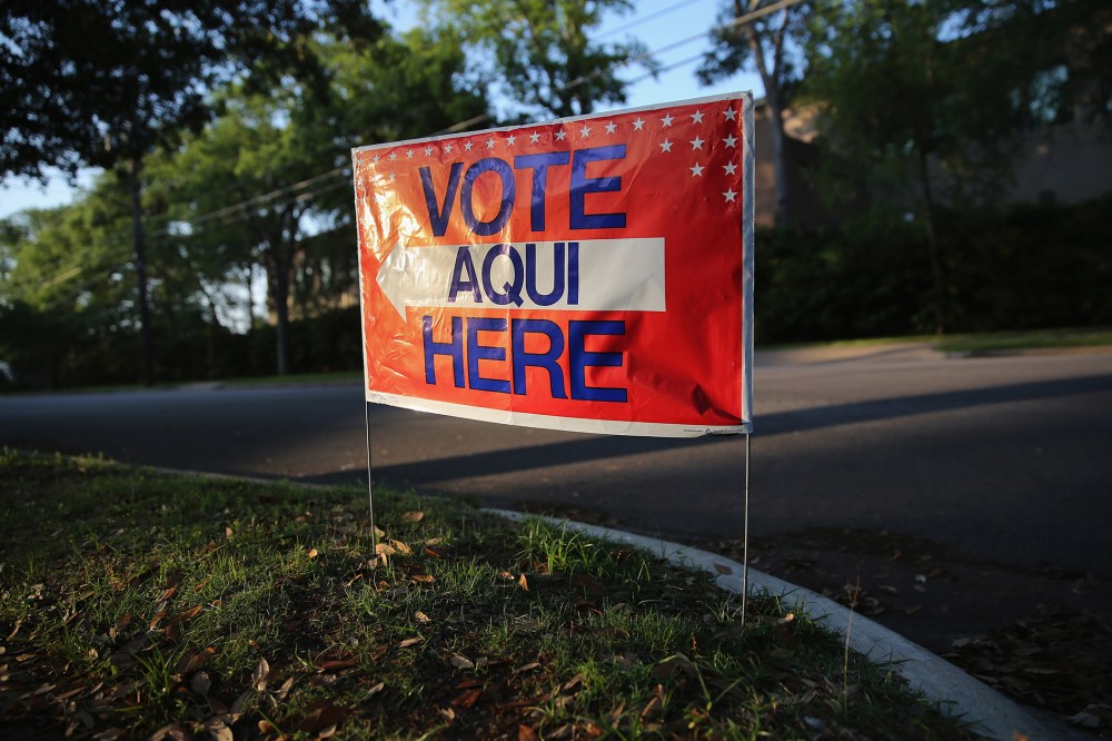 A sign stands outside a polling center at public library ahead of local elections on April 28, 2013 in Austin, Texas. (Photo by John Moore/Getty)