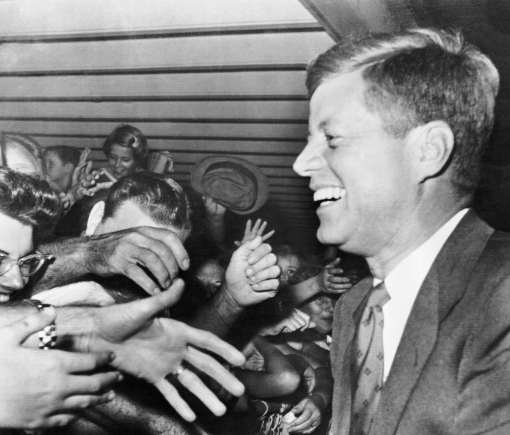 President-elect John F Kennedy smiles as hundreds of well-wishers greet him at the West Palm Beach Airport, Fla. Nov. 11, 1960.