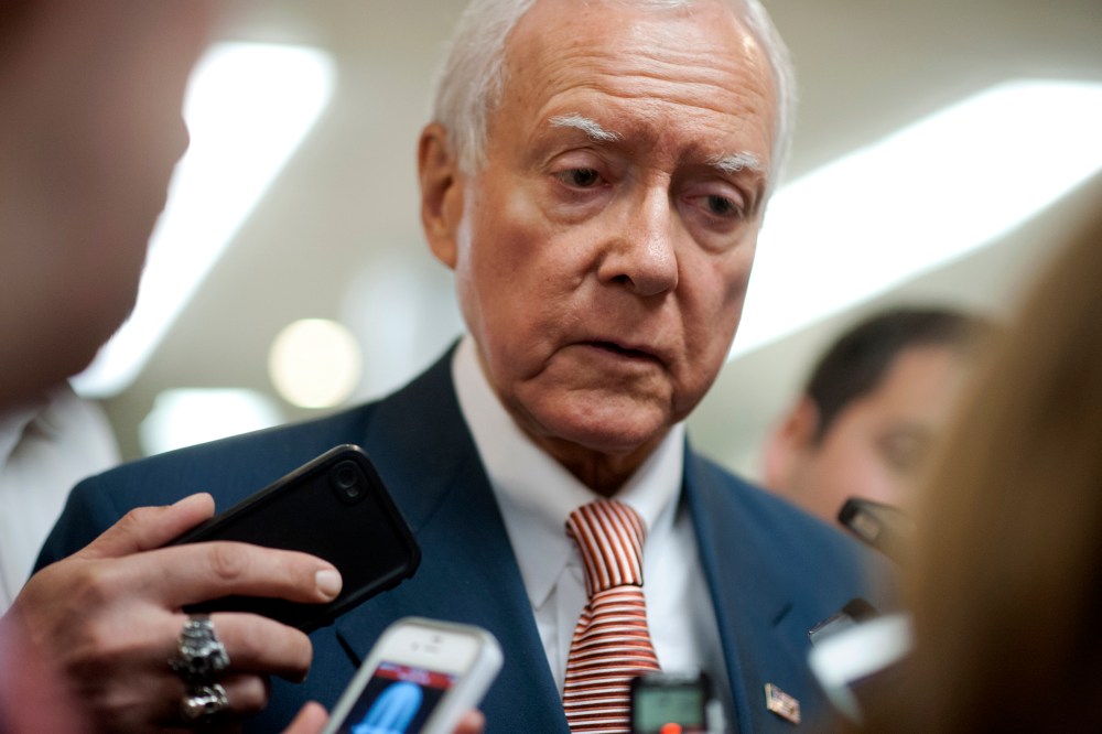 Sen. Orrin Hatch, R-UT., talks to reporters as he walks to the weekly Senate policy luncheons in the U.S. Capitol on June 4, 2013.