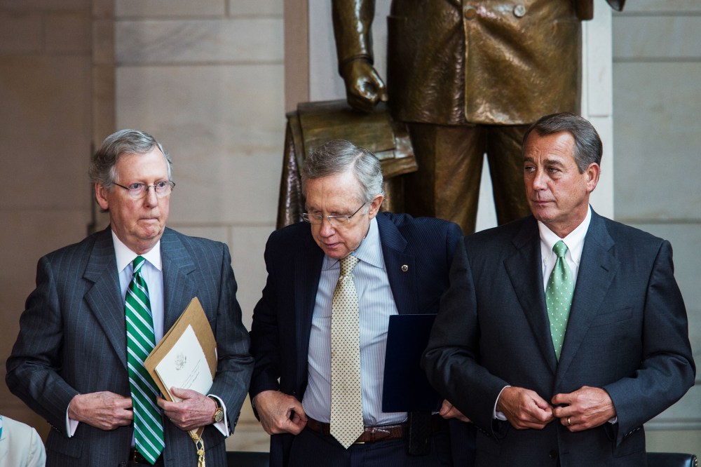 Mitch McConnell, Harry Reid, and John Boehner prepare to take their seats for a dedication ceremony at the U.S. Capitol, June 19, 2013.