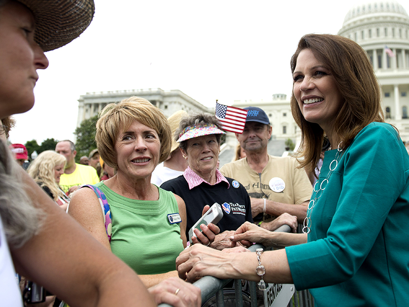 Minnesota Republican Representative Michele Bachmann greets demonstrators with the Tea Party during a protest against the Internal Revenue Service (IRS) targeting of the Tea Party and similar groups outside the US Capitol in Washington, DC, June 19,...