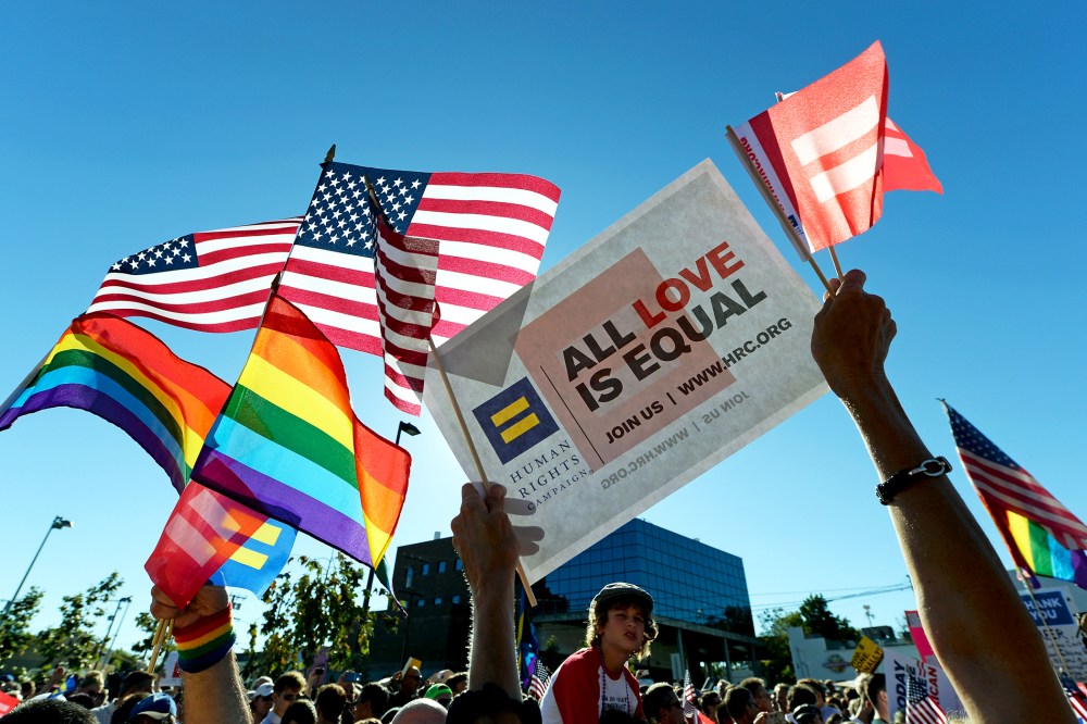 Same-sex marriage supporters celebrate the US Supreme Court ruling during a community rally on June 26, 2013