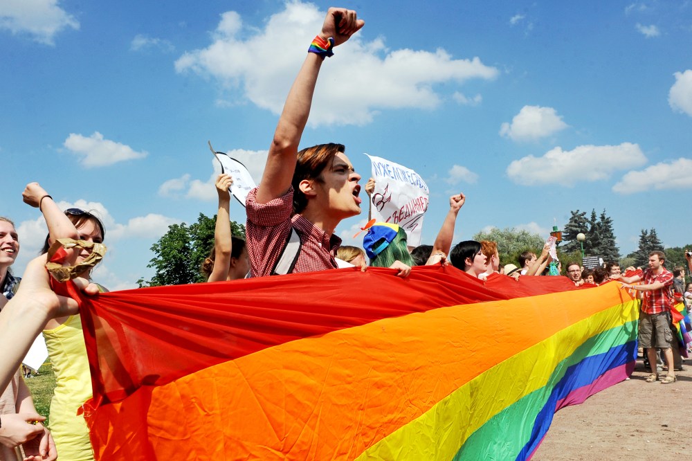 Gay rights activists take part in a gay pride event in Saint Petersburg on June 29, 2013.