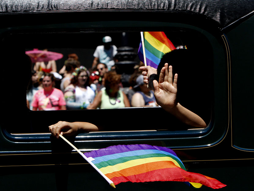 One of the historic cars makes its way down Market St. during the 43rd annual San Francisco Lesbian, Gay, Bisexual, Transgender (LGBT) Pride Celebration & Parade June 30, 2013, in San Francisco, California.  (Photo by Sarah Rice/Getty Images)