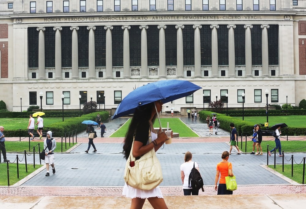 People walk through the Columbia University campus on July 1, 2013.