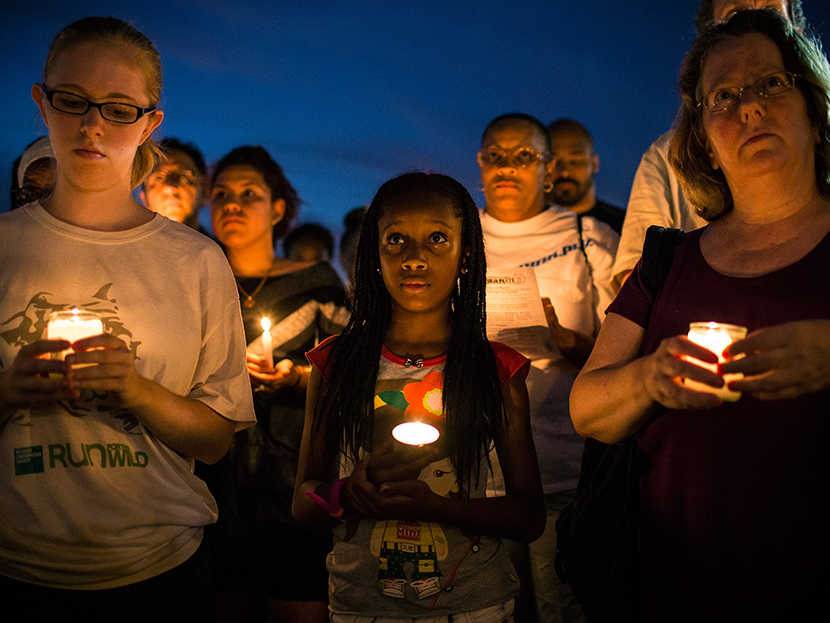 Aaliyah Wright, 9, participates in a candle lit vigil for Trayvon Martin, the teenager who was shot and killed in Florida last year, on July 15, 2013 in New York City. (Photo by Andrew Burton/Getty Images)