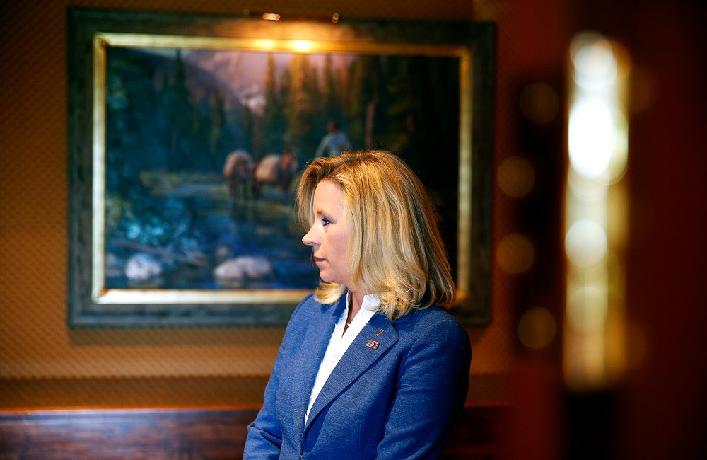 Liz Cheney waits in the hallway for a news conference to begin in Cheyenne, Wyoming, July 17, 2013.
