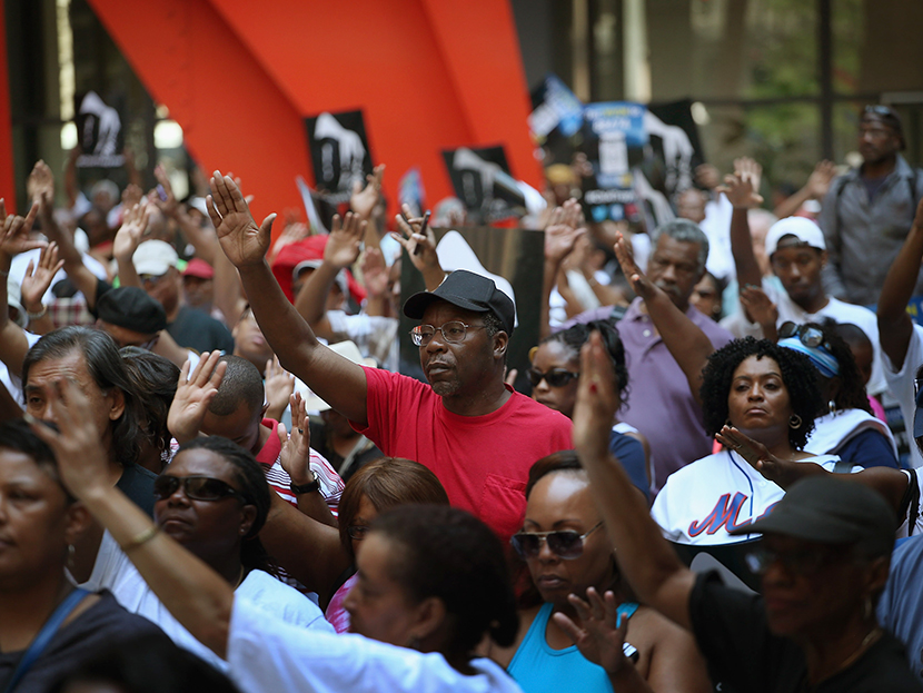 Demonstrators attend a "Justice For Trayvon" rally at Federal Plaza in the Loop July 20, 2013 in Chicago, Illinois. (Photo by Scott Olson/Getty Images)