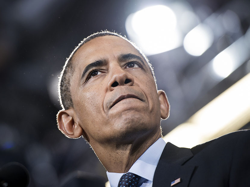 President Barack Obama pauses while speaking at Knox College July 24, 2013, in Galesburg, Ill. Obama is traveling to Illinois and Missouri to speak about the economy. (Photo by Brendan Smialowski/AFP/Getty Images)