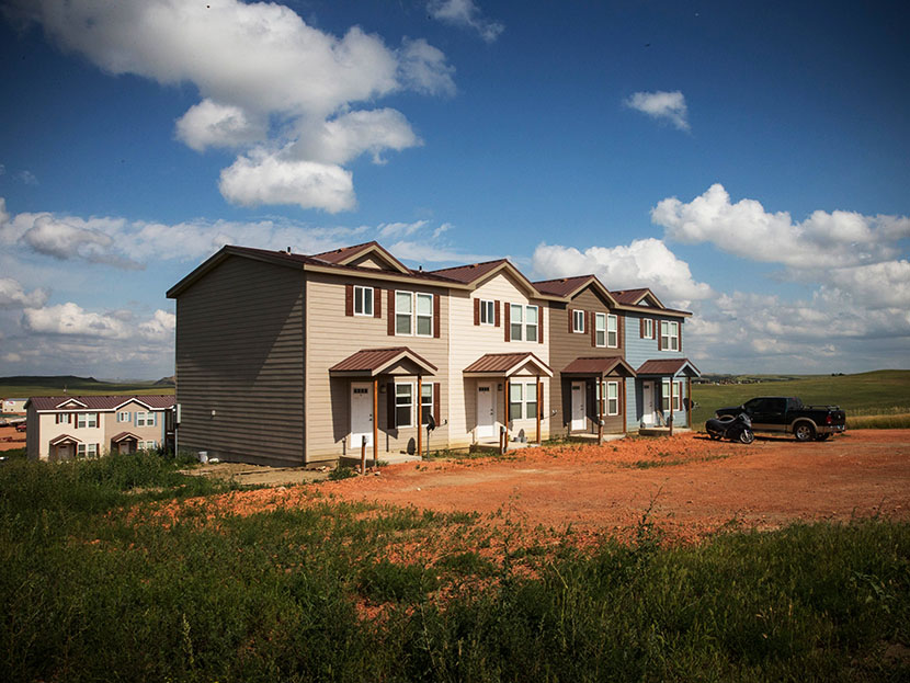 New townhouses are seen next to a highway on July 29, 2013 in Watford City, North Dakota. (Photo by Andrew Burton/Getty)