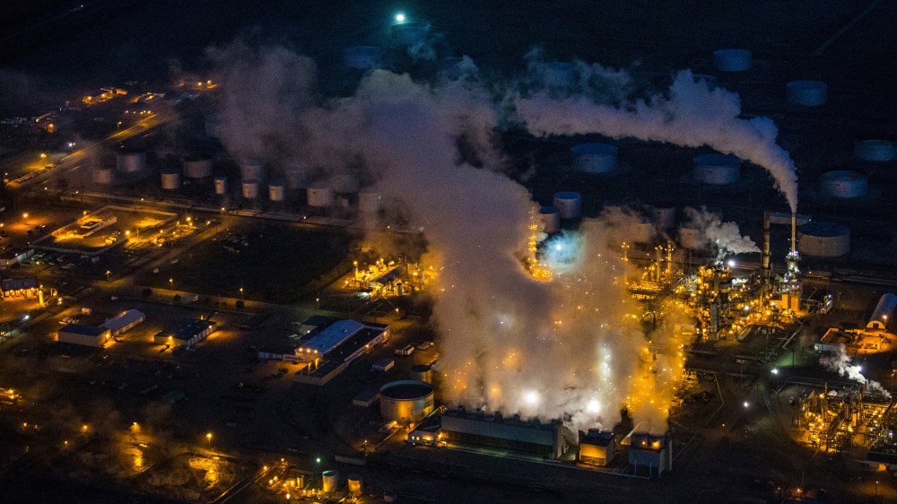 A gas and oil refinery is seen in an aerial view in the early morning hours of July 30, 2013 in Bismarck, North Dakota. (Photo by Andrew Burton/Getty)