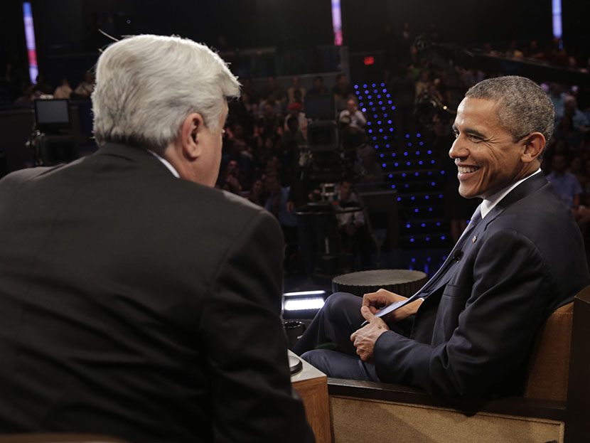 Jay Leno talks with President Barack Obama during a commerical break on August 6, 2013 (Photo by Paul Drinkwater/NBC/Getty Images)