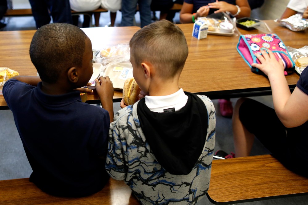 Children eat lunch at Roger Clap Innovation School in Dorchester, Mass., on Aug. 30, 2013