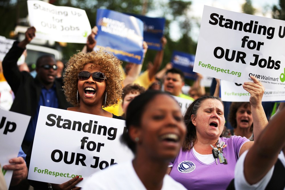 Hundreds of demonstrators rally outside a Walmart store in Hyattsville, Maryland, Sept. 5, 2013.