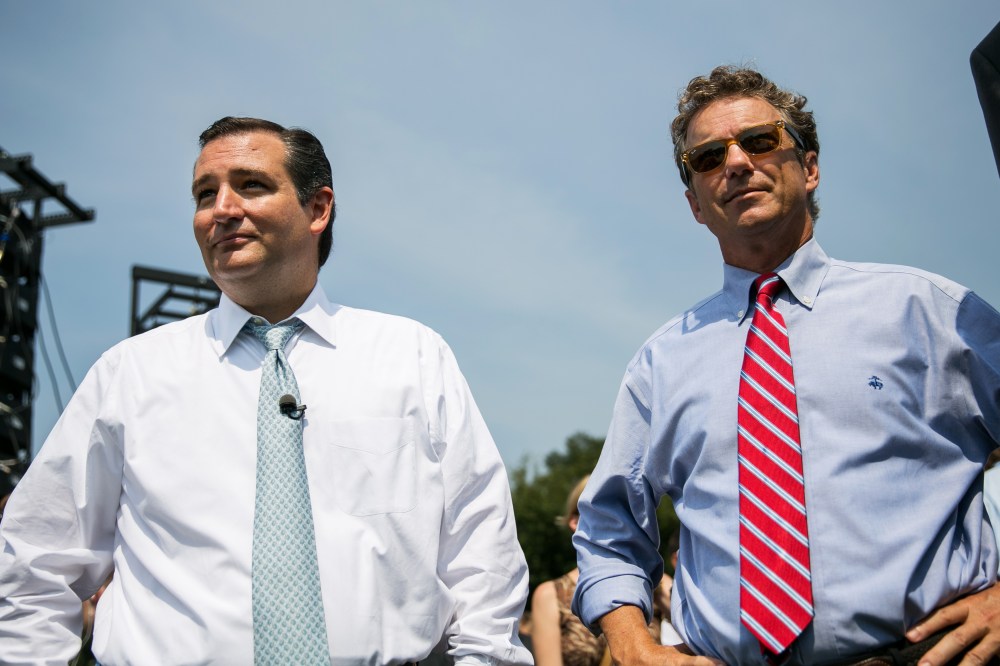 U.S. Sen. Ted Cruz (R-TX) (L) and Sen. Rand Paul (R-KY) wait to speak at the "Exempt America from Obamacare" rally,  on Capitol Hill on Sept. 10, 2013 in Washington, DC.