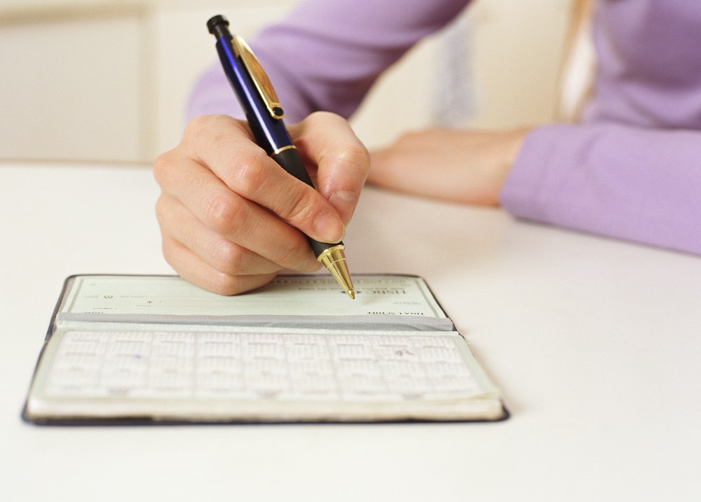Image: Writing in checkbook