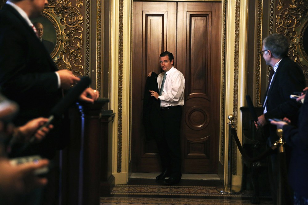 Sen. Ted Cruz (R-TX) leaves after the weekly Senate Republican Policy Committee luncheon, Sept. 24, 2013 on Capitol Hill in Washington, DC.