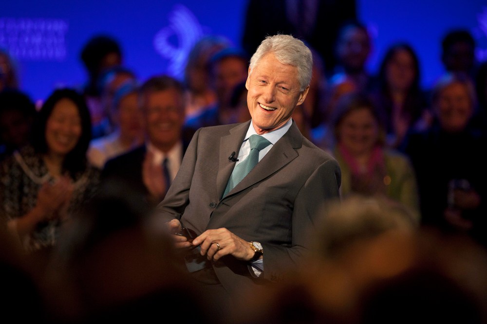 Former U.S. President Bill Clinton smiles during a taping in New York City, Sept. 25, 2013.