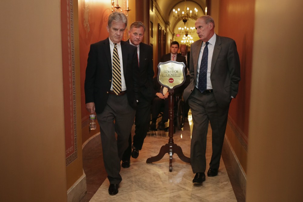 (L-R) Sen. Tom Coburn (R-OK), Sen. Richard Burr (R-NC) and Sen. Dan Coats (R-IN) leave a Republican Senate caucus meeting at the U.S. Capitol September 30, 2013 in Washington, DC.