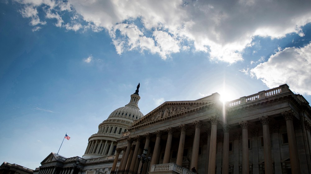 The sun begins to set behind the US Capitol in Washington, D.C.