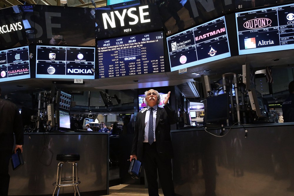 Traders work on the floor of the New York Stock Exchange