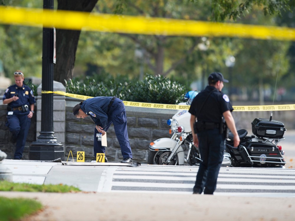 Capitol Police look at evidence on Capitol Hill following reports of a shooting on October 3, 2013 in Washington, DC.