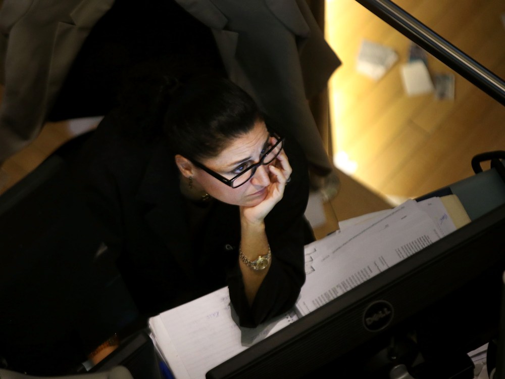 A trader works on the floor of the New York Stock Exchange on October 7, 2013 in New York City.