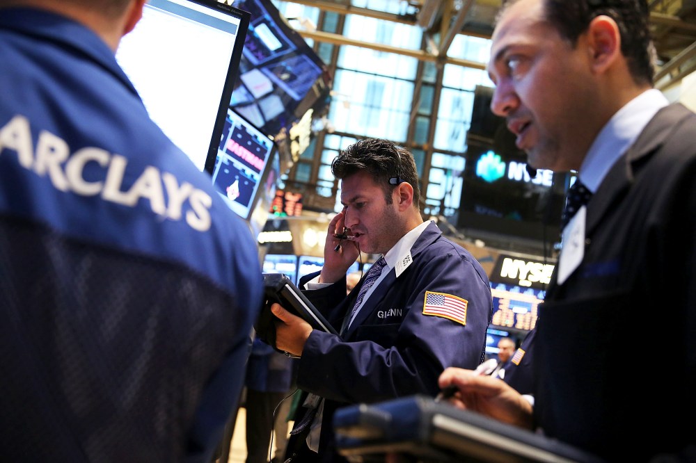 Traders work on the floor of the New York Stock Exchange on October 7, 2013 in New York City.