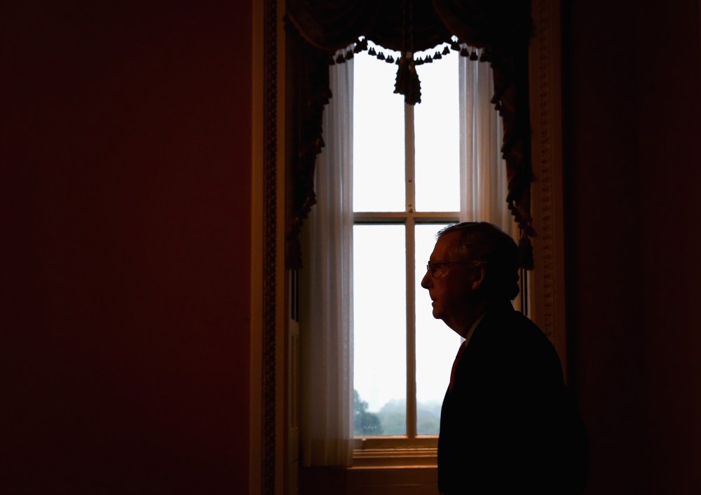 Senate Minority Leader Mitch McConnell (R-KY) returns to his office after speaking in the Senate Chamber, October 7, 2013.