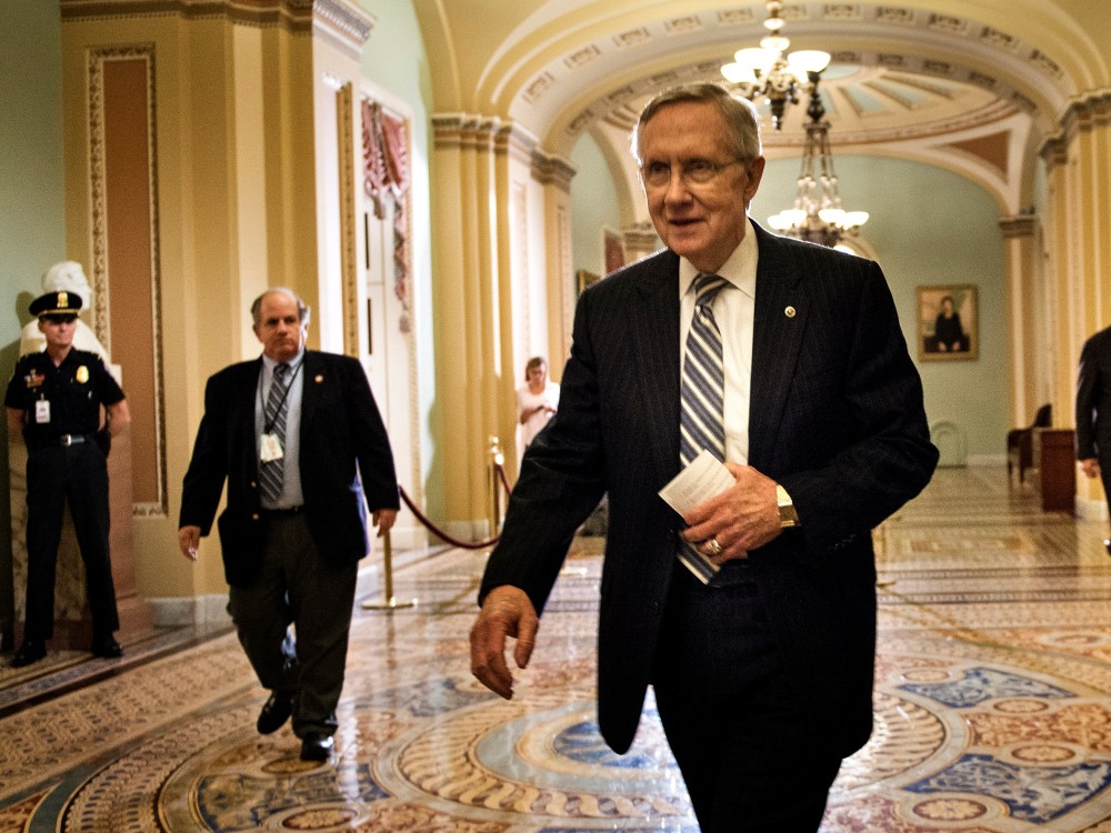 Senate Majority Leader Senator Harry Reid walks from the Senate floor after a vote on Capitol Hill October 16, 2013 in Washington, DC.